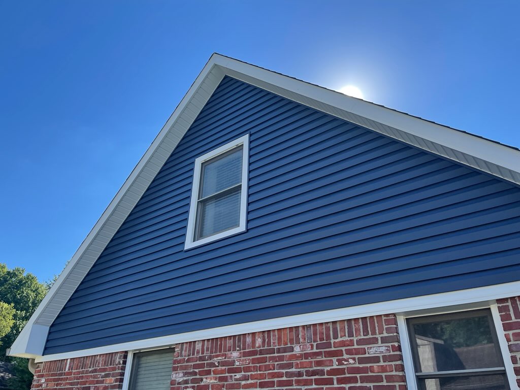 Brick home with blue siding