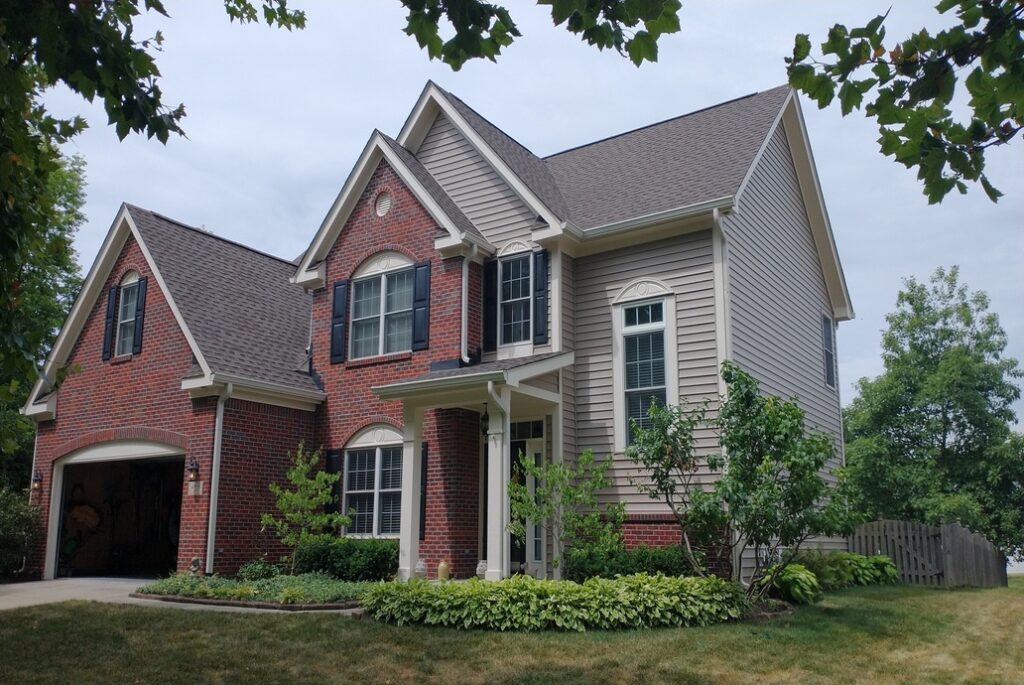 red brick and tan siding