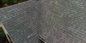 Rooftop marked with chalk circles identifying hail damage after a storm