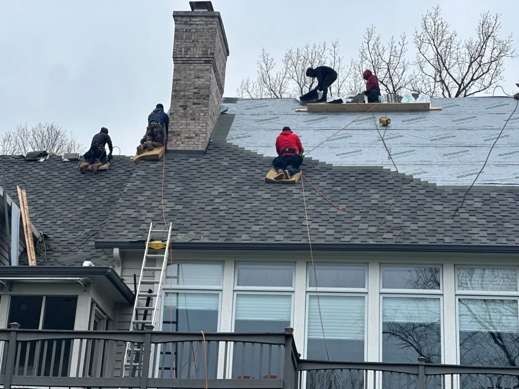 Moss Roofing team on Indianapolis home performing a roof replacement