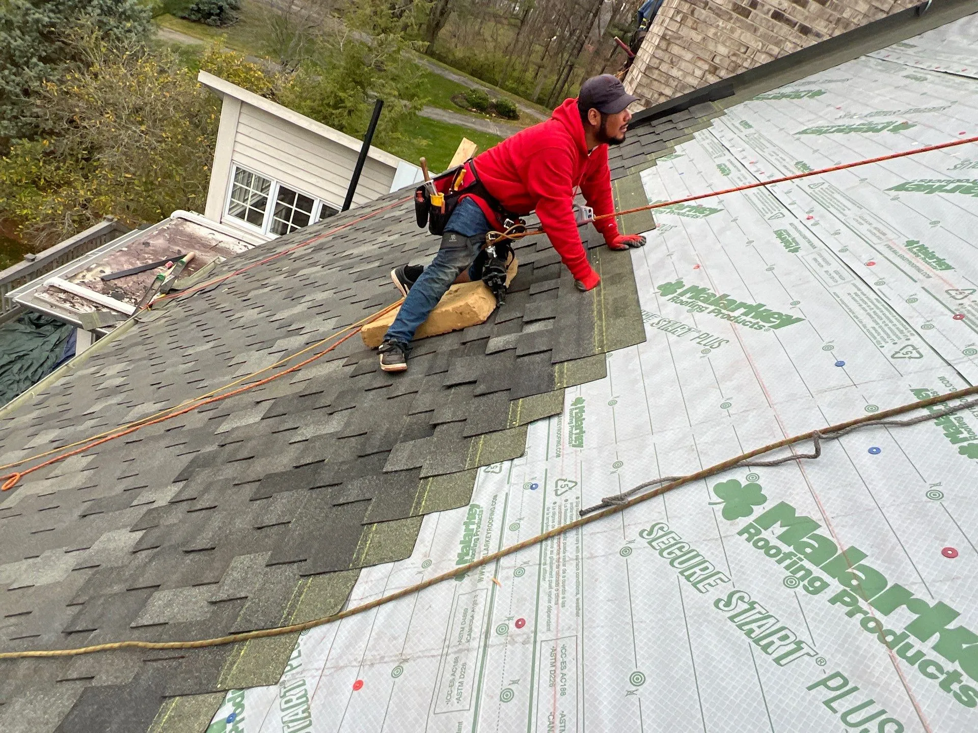 Moss Roofer in Indianapolis installing a new roof on a residential home
