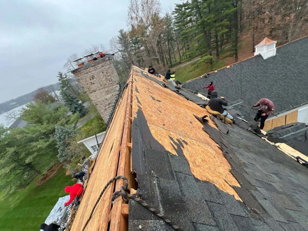 Moss roofing team installing shingles in Indianapolis