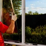Contractor replacing window on a home