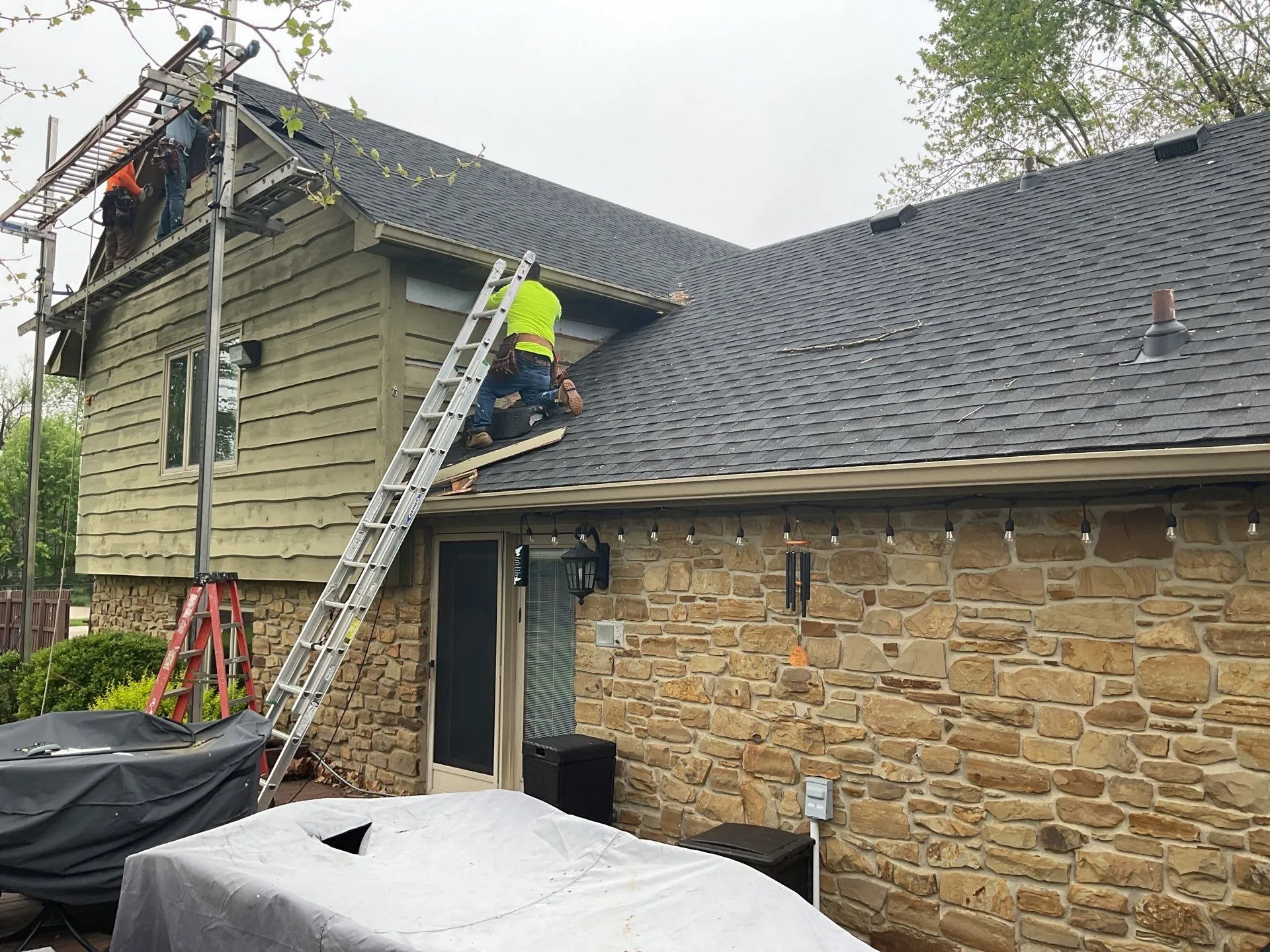 Moss team on residential roof
