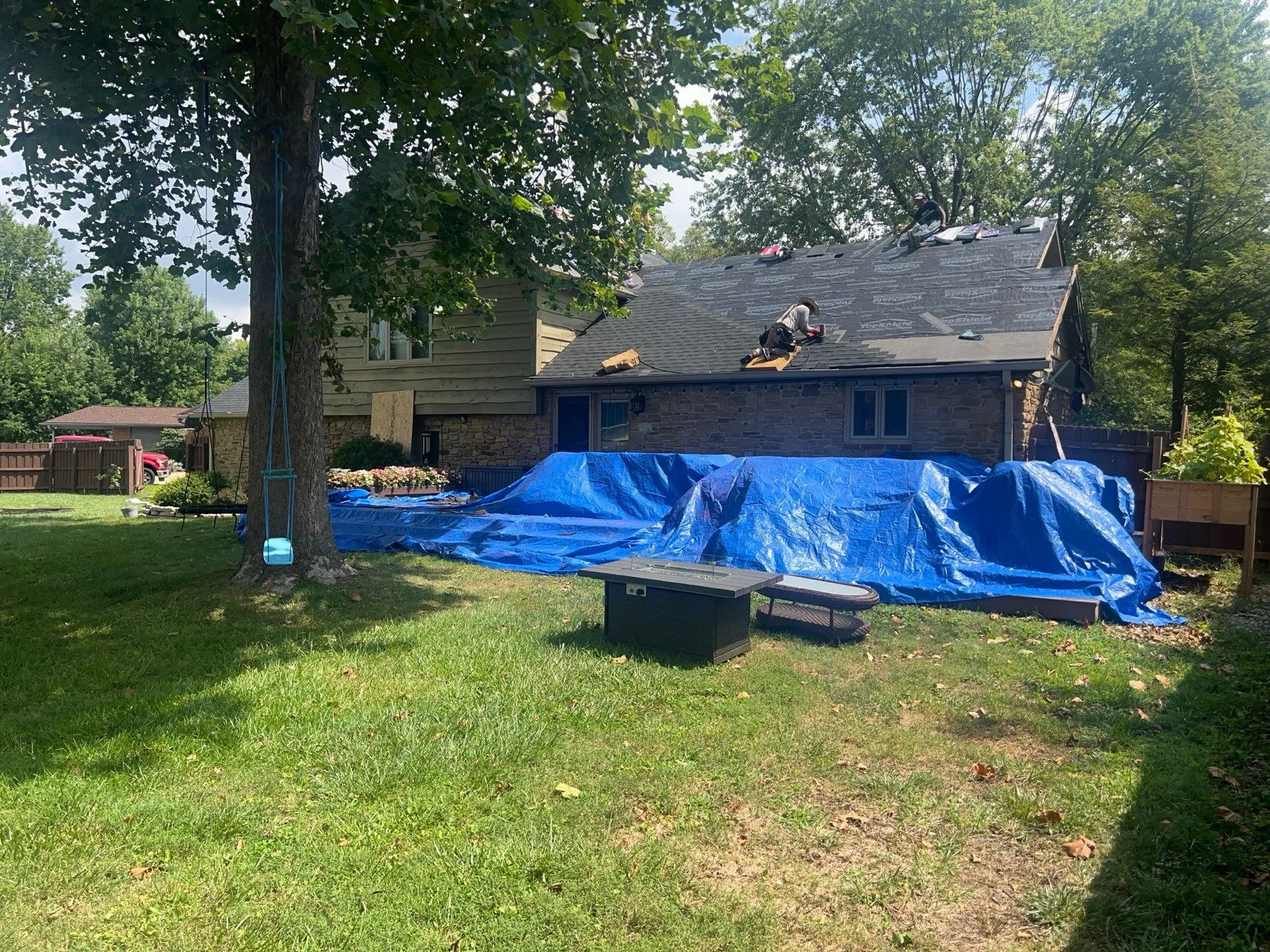 Home in Greenwood Outdoor area tarped for protection