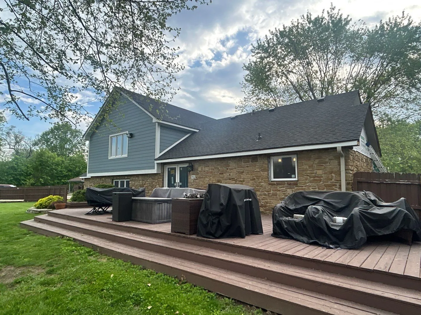 Residential home with new roof, siding and improved outdoor area. 