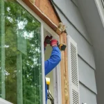 Professional contractor installing new replacement window for Central Indiana home showing when to replace windows
