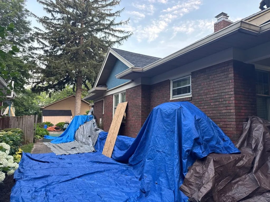 tarping set up to protect property around roof replacement