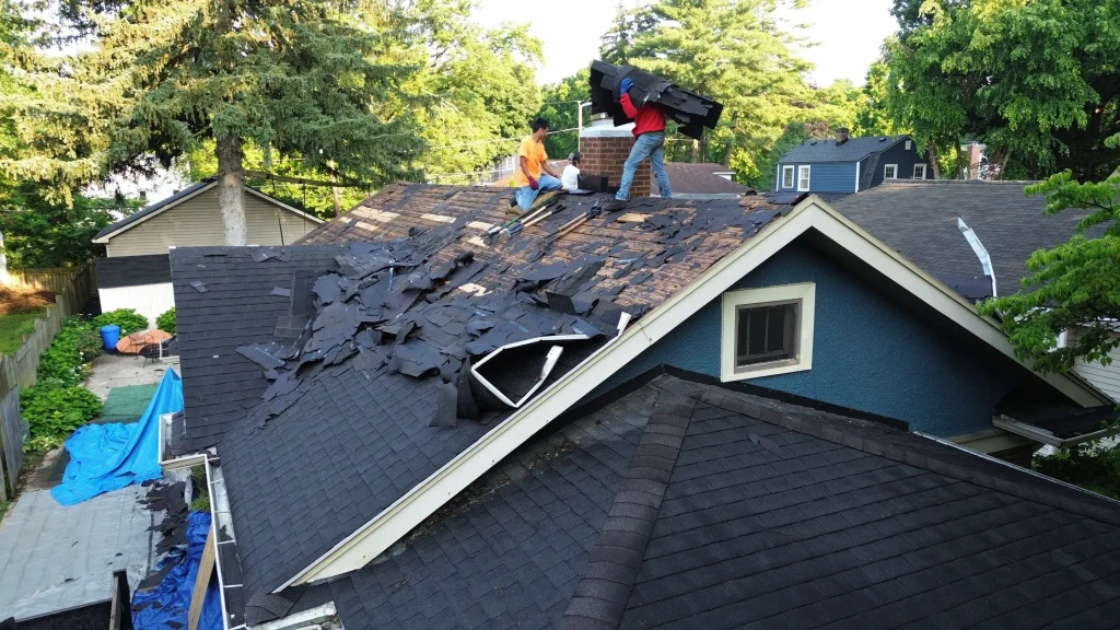 Moss Roofing team removing the old shingles