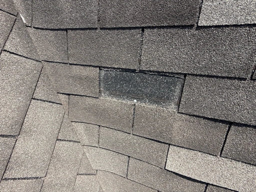 Missing shingles on residential home in Plainfield, found during roof inspection before roof replacement project