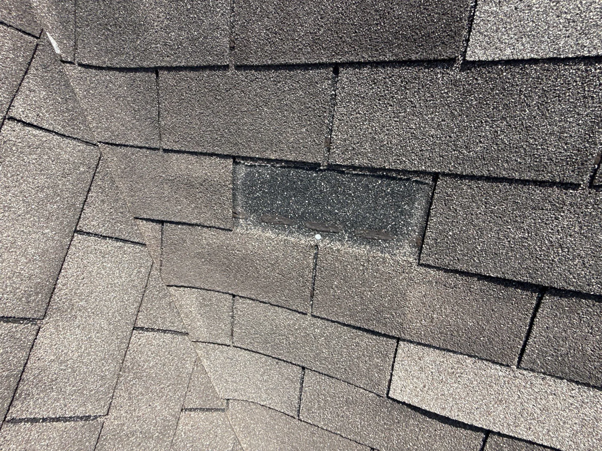 Missing shingles on residential home in Plainfield, found during roof inspection before roof replacement project