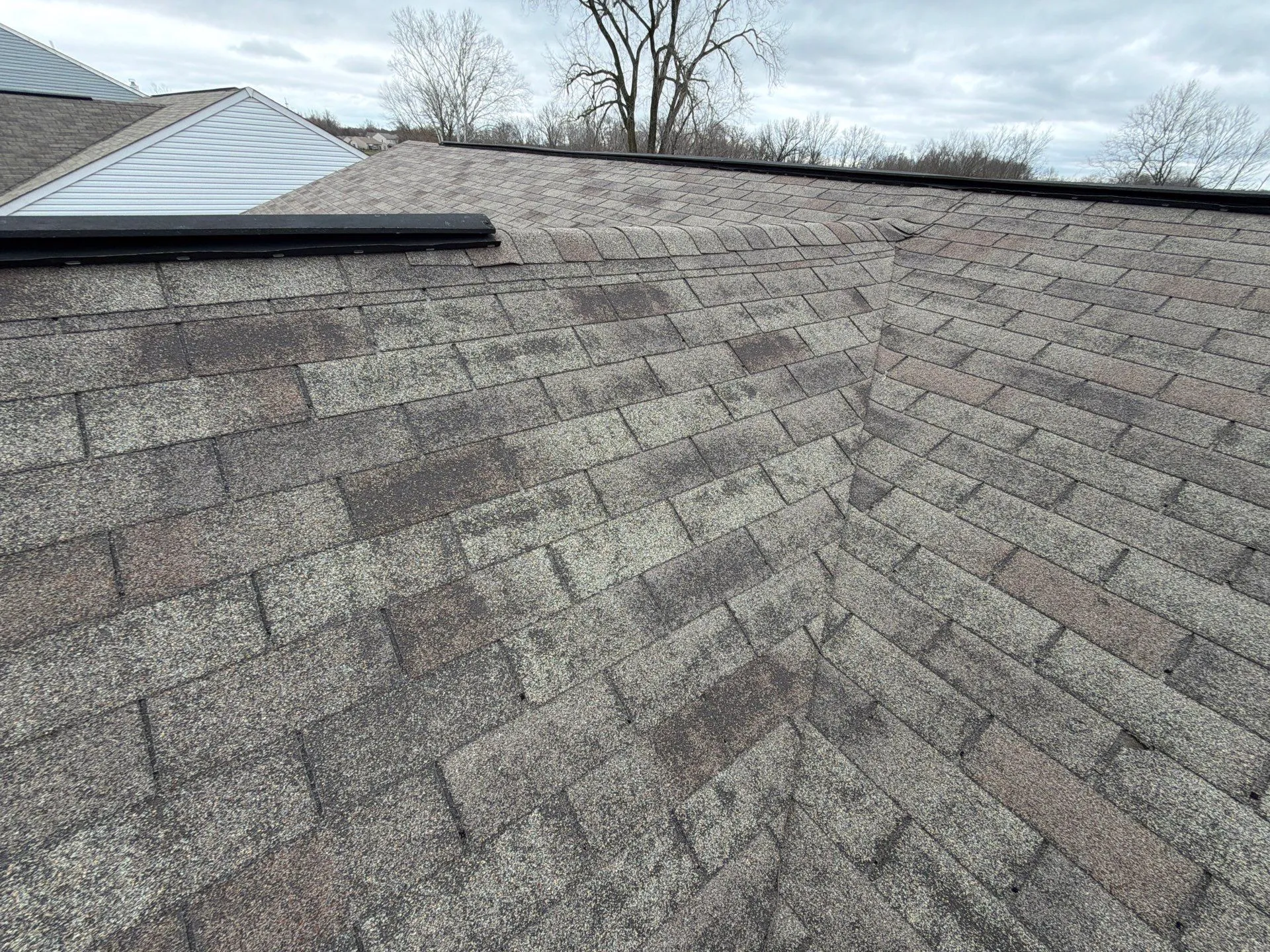 Worn shingle roof