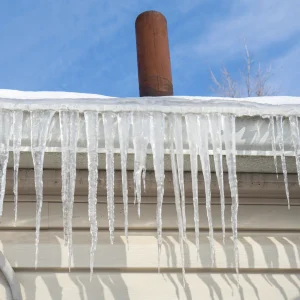 Ice dam on the edge of a roof.
